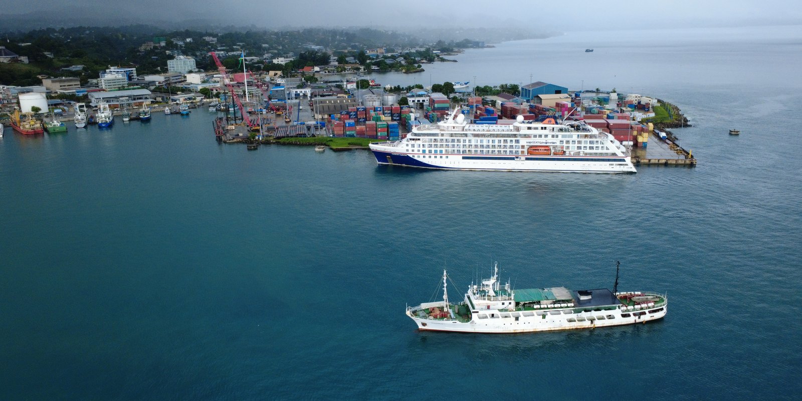 Aerial view of Honiara port with cruise ship and containers